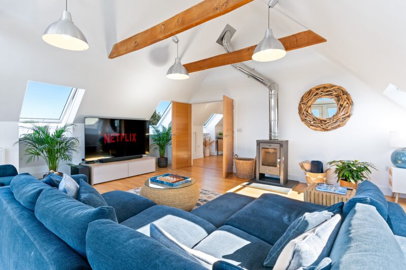 Airbnb Photography in Wadebridge: How Stunning Photos Boost Your Bookings 7 Cozy Cornish cottage with fireplace and warm lighting